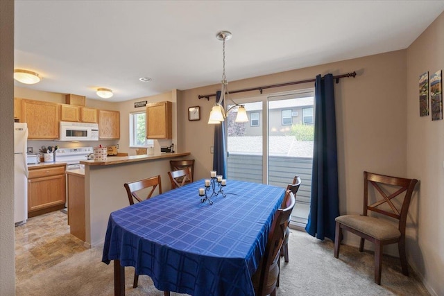 view of carpeted dining area