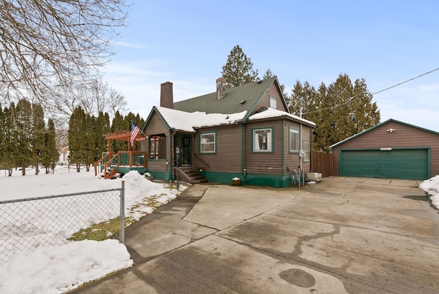 view of front of home featuring an outbuilding and a garage