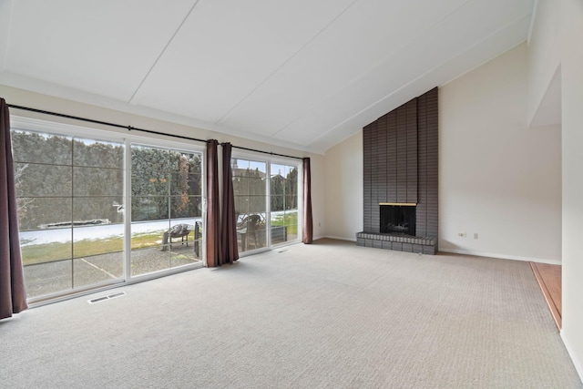 unfurnished living room featuring a fireplace, high vaulted ceiling, and carpet