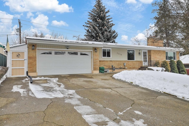 single story home with a garage