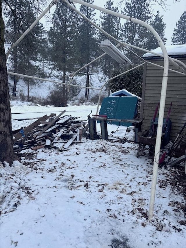 view of yard layered in snow