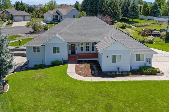 view of front of property featuring a front lawn and a garage