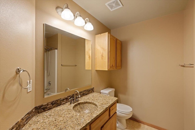 full bathroom featuring vanity, toilet, and washtub / shower combination