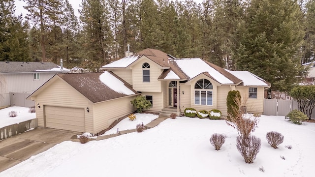 split level home featuring a garage and driveway