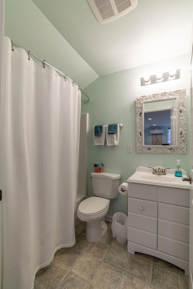 full bathroom featuring toilet, lofted ceiling, shower / tub combo with curtain, and vanity