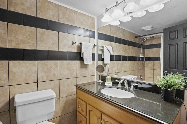 bathroom featuring toilet, vanity, walk in shower, and tile walls