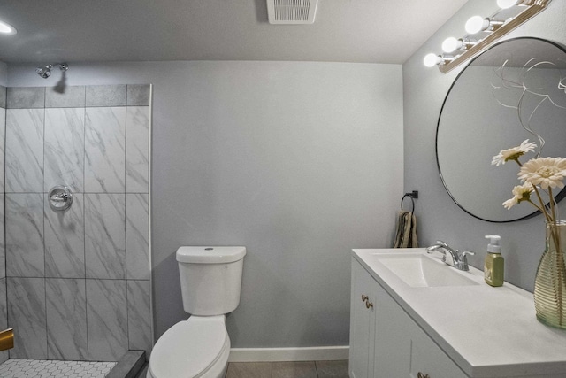 full bathroom with baseboards, visible vents, toilet, tile patterned floors, and vanity