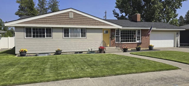 view of front of home with entry steps, driveway, a chimney, an attached garage, and a front lawn