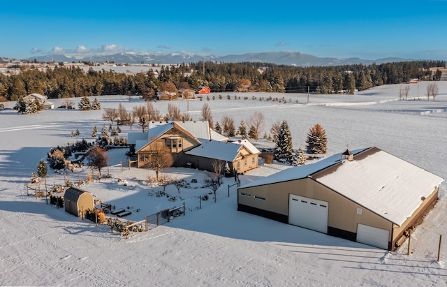 snowy aerial view with a mountain view