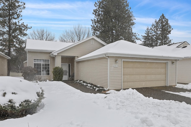 ranch-style house featuring an attached garage