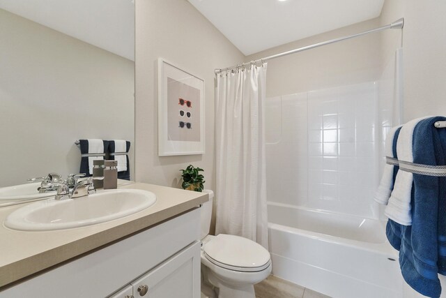 full bath featuring shower / bath combo, vanity, and toilet