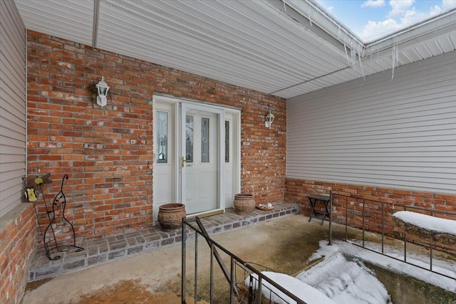 entrance to property with brick siding