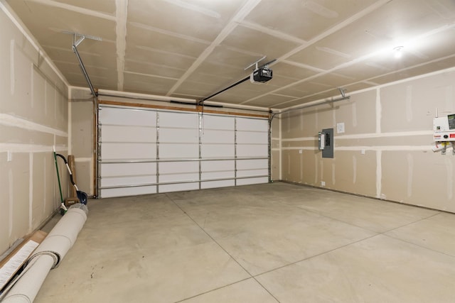garage with electric panel and a garage door opener