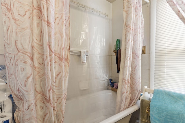 bathroom featuring shower / bathtub combination with curtain