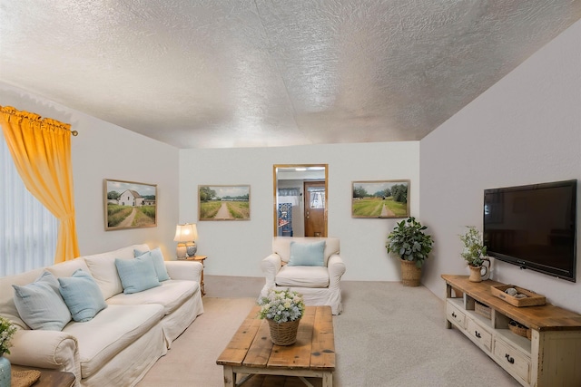 living area with light carpet and a textured ceiling