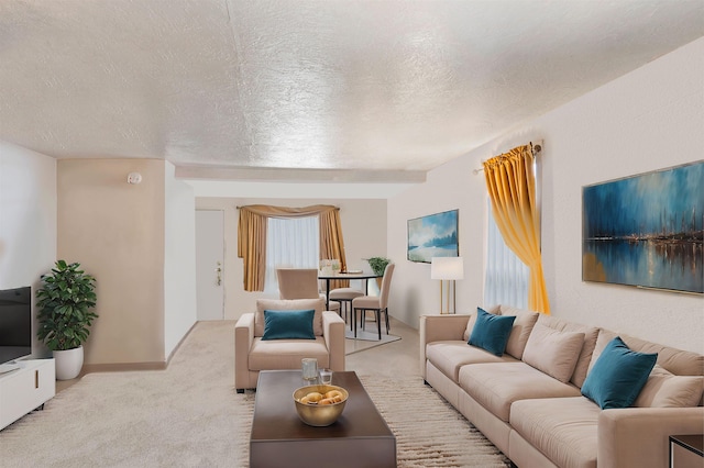 living room featuring light carpet and a textured ceiling