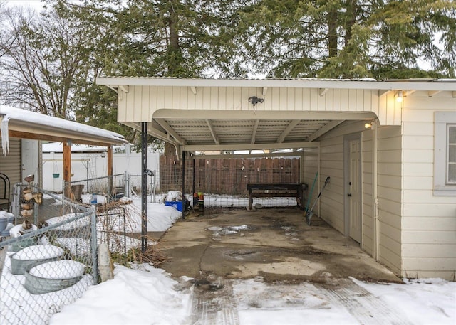 exterior space featuring driveway and fence