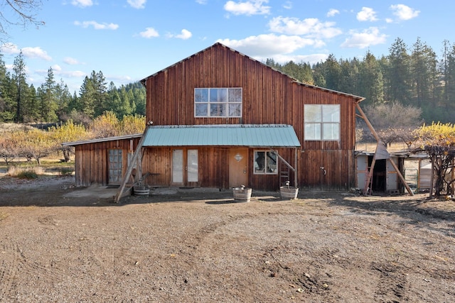 view of front of property featuring metal roof