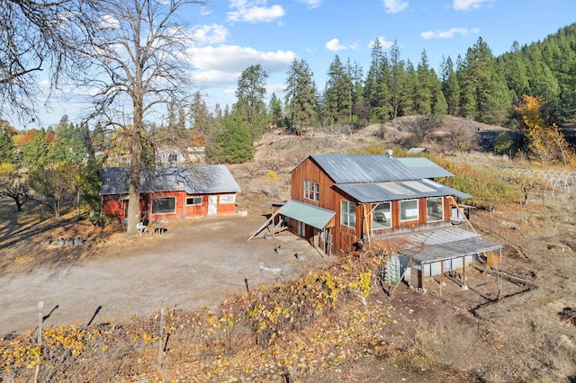 exterior space featuring dirt driveway