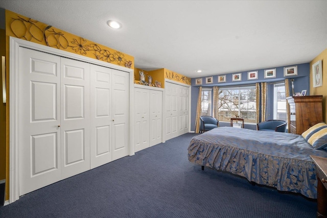 bedroom with carpet floors, recessed lighting, and multiple closets