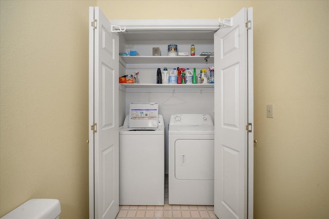 laundry room featuring laundry area, light floors, and washer and dryer