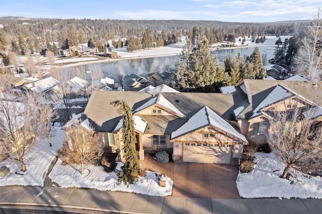 snowy aerial view with a residential view