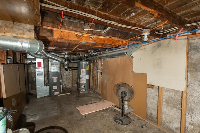 unfinished basement featuring gas water heater and heating unit