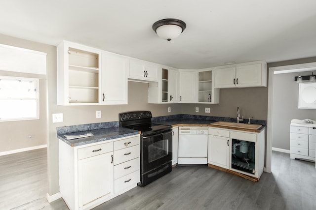 kitchen with black range with electric stovetop, white dishwasher, a sink, and open shelves