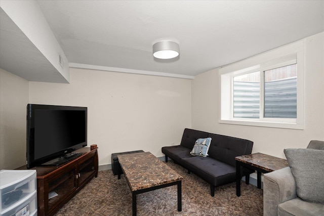 living area featuring carpet floors and visible vents