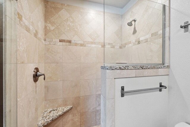 full bathroom featuring a walk in shower