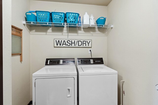 laundry room featuring independent washer and dryer and laundry area