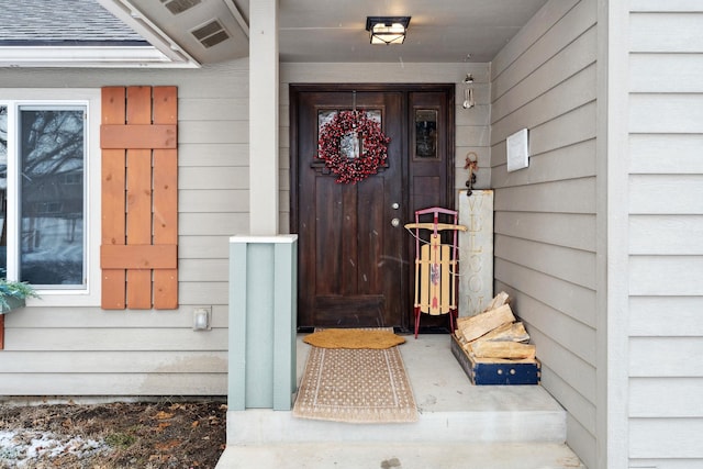doorway to property featuring visible vents