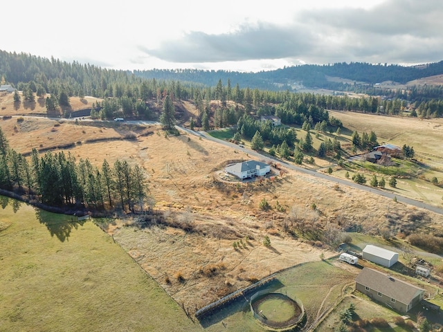 aerial view featuring a rural view and a view of trees