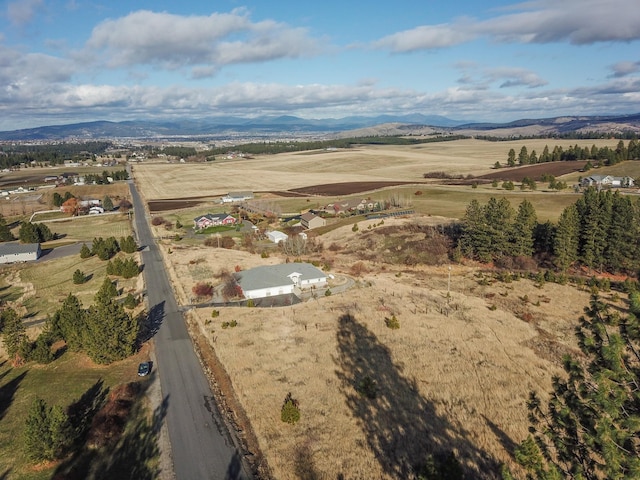 bird's eye view featuring a rural view and a mountain view