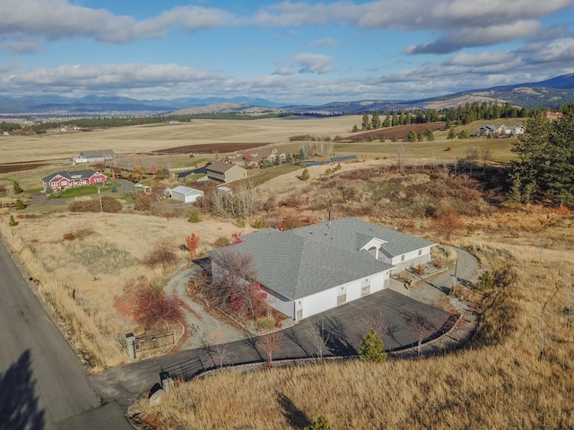 bird's eye view featuring a mountain view and a rural view