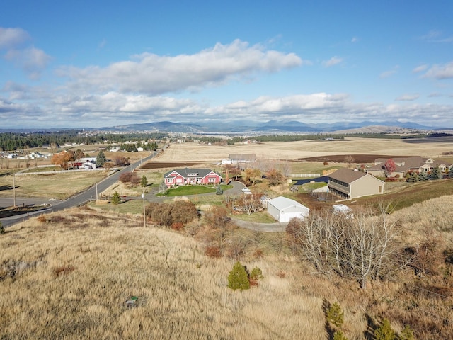 drone / aerial view featuring a rural view and a mountain view