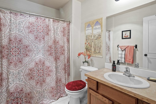 bathroom featuring vanity, toilet, and tile patterned floors