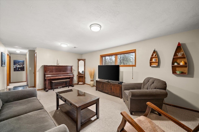 living room featuring baseboards, a textured ceiling, and light colored carpet