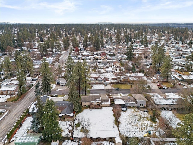 snowy aerial view featuring a residential view