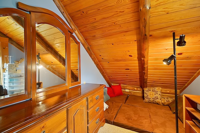 interior space with wooden ceiling and vaulted ceiling with beams