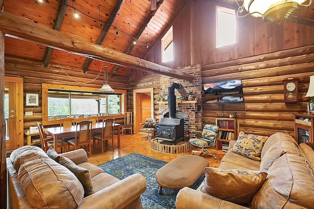 living area with wood ceiling, high vaulted ceiling, beam ceiling, and a wood stove