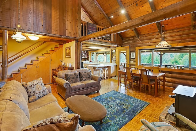 living room featuring rustic walls, wooden ceiling, stairway, beamed ceiling, and high vaulted ceiling