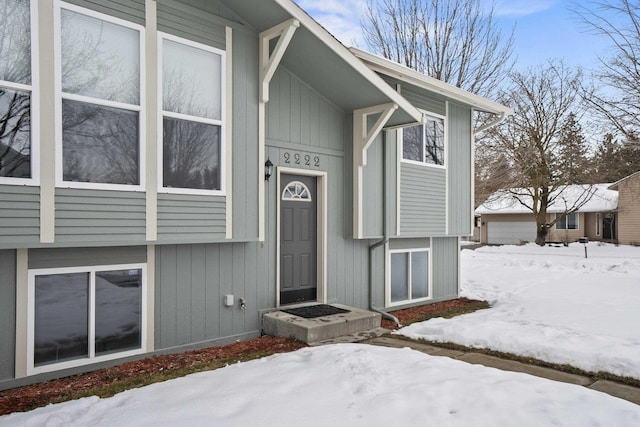 view of snow covered property entrance