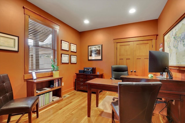 office featuring light wood-style floors, baseboards, visible vents, and recessed lighting