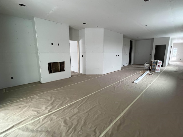 unfurnished living room featuring a fireplace