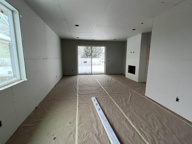 spare room featuring a fireplace