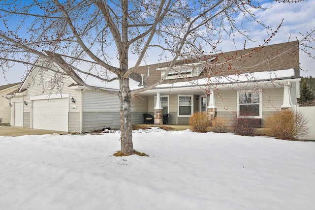 view of front of house with a garage and covered porch