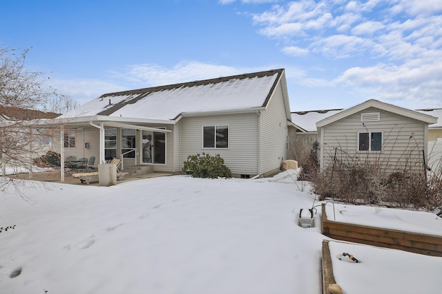 view of snow covered house