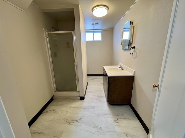 bathroom featuring vanity, visible vents, baseboards, marble finish floor, and a stall shower