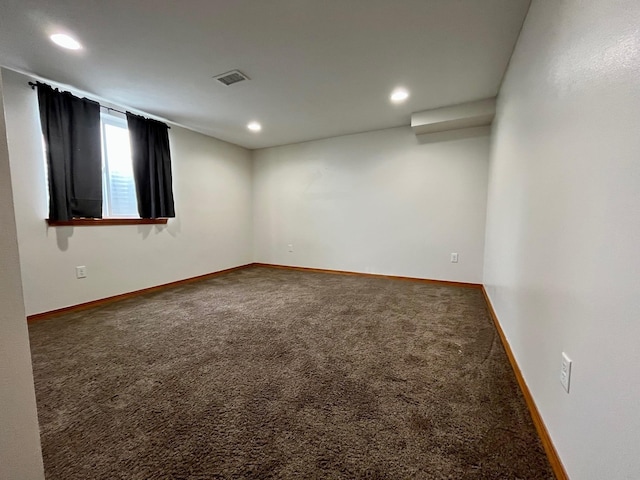 carpeted empty room with recessed lighting, visible vents, and baseboards